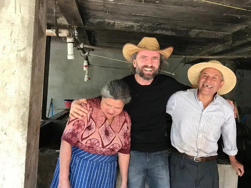 Three people wearing hats.